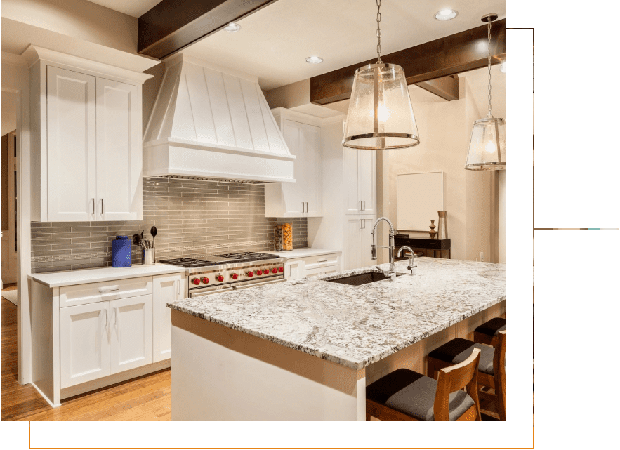 VSPLASH-1492621 (3) A kitchen with white cabinets and granite counter tops.